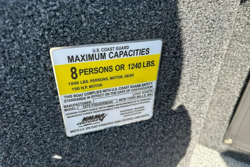 Slide: The Image of 2026 Lund 1875 Fisherman capacity label, 8 persons or 1240 lbs, 150 HP motor. - 38