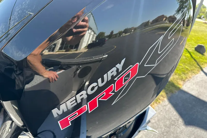 Slide: The Image of Mercury Pro XS engine on 2026 Lund 1875 Fisherman boat, reflecting surroundings. - 40