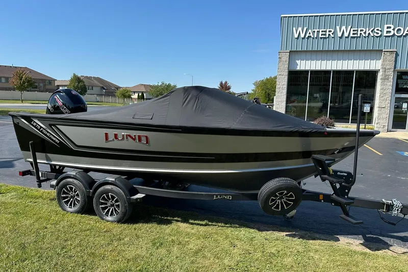 Slide: The Image of 2026 Lund 1875 Fisherman boat on trailer outside Water Werks dealership. - 41
