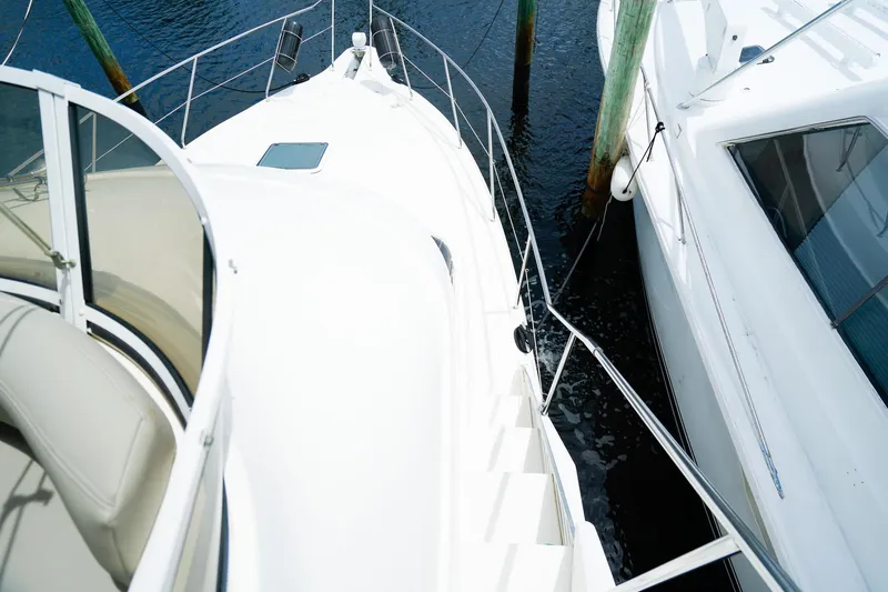 Slide: The Image of 2002 Silverton 352 Motor Yacht docked beside another boat, viewed from above. - 21