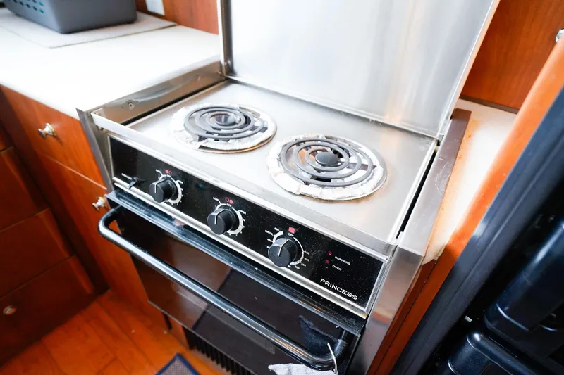 Slide: The Image of Stove and oven in 2002 Silverton 352 Motor Yacht kitchen area. - 35