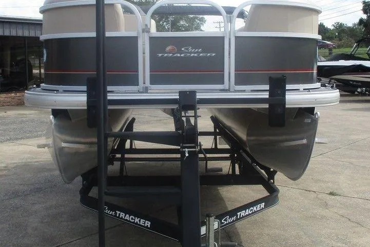 Slide: The Image of 2018 Sun Tracker Party Barge 18 DLX pontoon boat on trailer. - 3