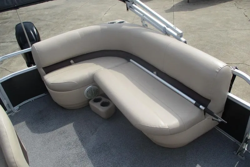 Slide: The Image of 2018 Sun Tracker Party Barge 18 DLX with beige seating and cup holders. - 5