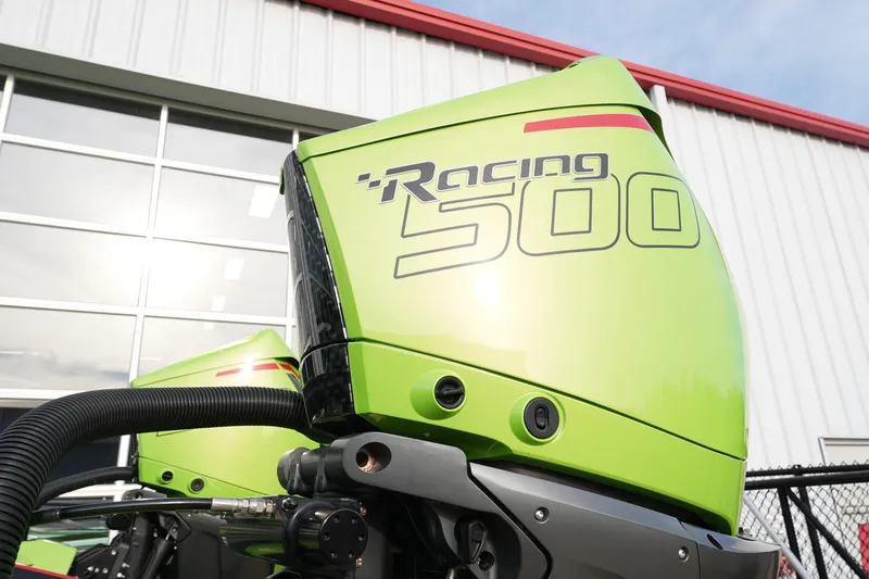 Slide: The Image of Green Racing 500 engine on MTI 440X, 2025 model, against industrial building backdrop. - 10