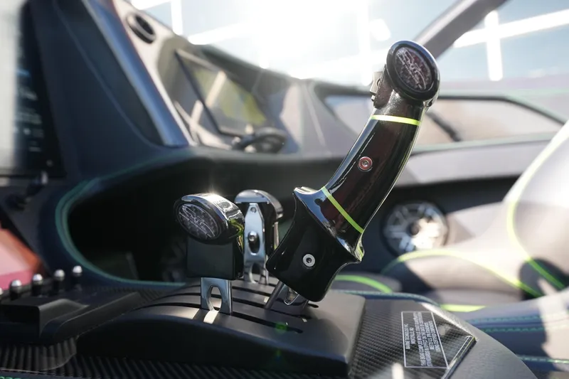 Slide: The Image of Close-up of MTI 440X 2025 boat controls with sleek design and modern dashboard. - 12