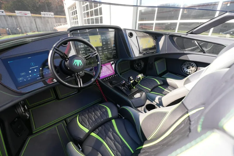 Slide: The Image of Interior of 2025 MTI 440X boat with advanced digital dashboard and luxurious seating. - 13