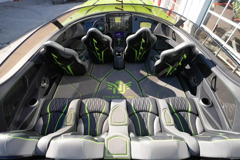 Slide: The Image of Interior of 2025 MTI 440X boat with sleek, modern seating and advanced dashboard. - 15