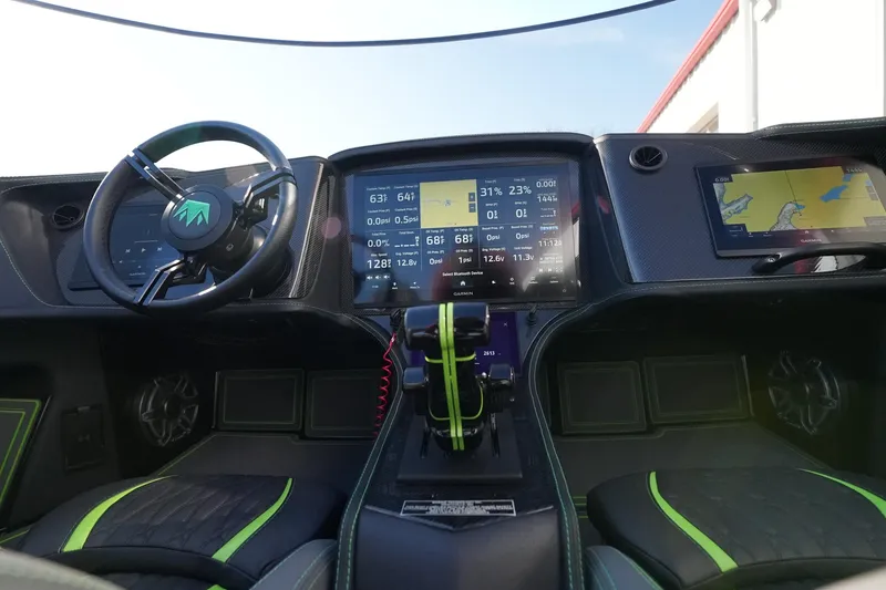 Slide: The Image of 2025 MTI 440X cockpit with advanced digital displays and sleek steering wheel design. - 29