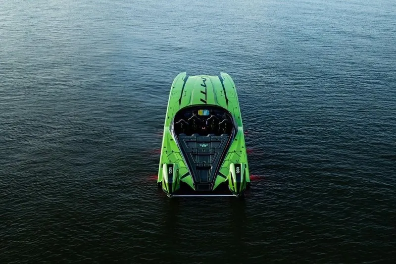Slide: The Image of 2025 MTI 440X powerboat with vibrant green design and dual 500R engines. - 4
