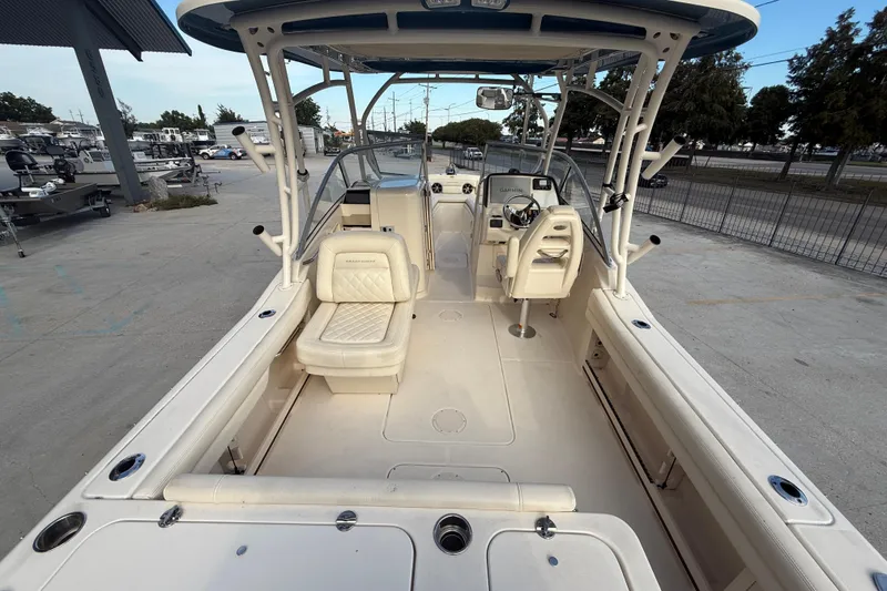 Slide: The Image of 2019 Grady-White Freedom 235 boat interior with seating and helm station. - 7