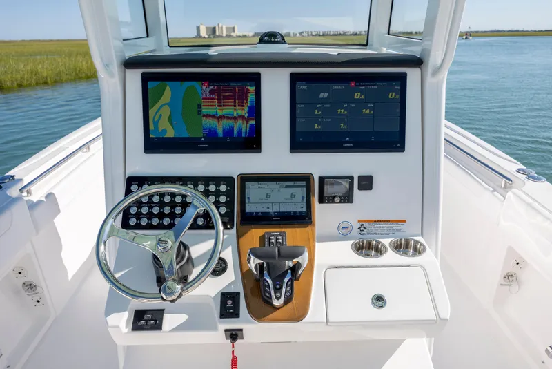 Slide: The Image of 2026 Caymas 291 HB boat dashboard with advanced navigation and control systems. - 17