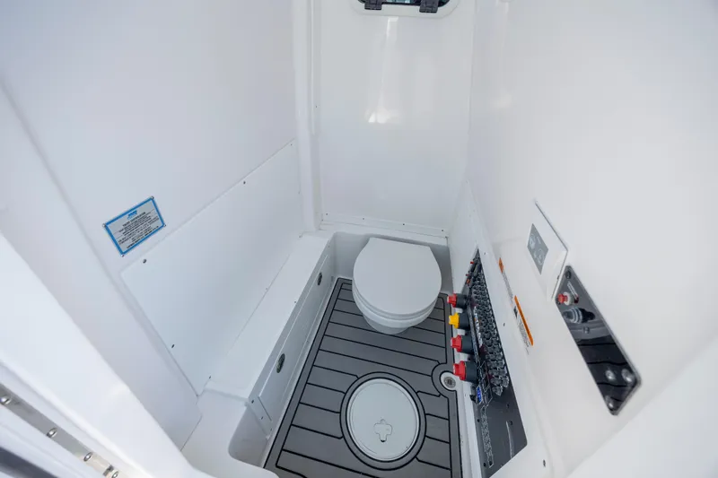 Slide: The Image of 2026 Caymas 291 HB boat interior bathroom with modern fixtures and controls. - 22