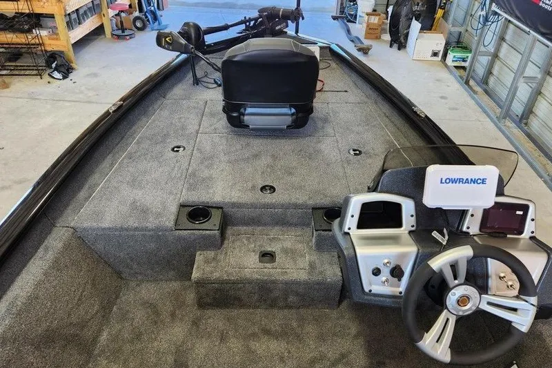 Slide: The Image of 2026 Tracker Pro Team 175 boat interior with steering wheel and Lowrance electronics. - 8