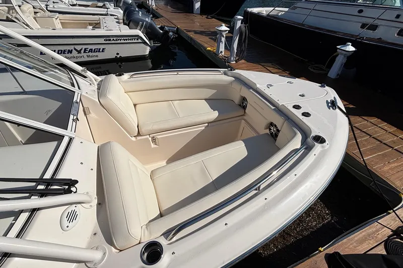 Slide: The Image of 2020 Grady-White Freedom 275 boat with spacious seating at dock. - 10