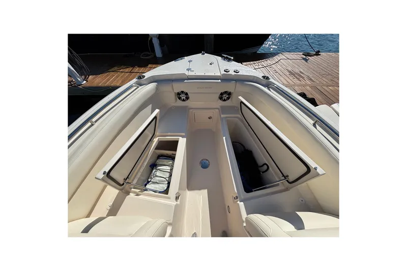 Slide: The Image of 2020 Grady-White Freedom 275 boat interior with open storage compartments. - 12