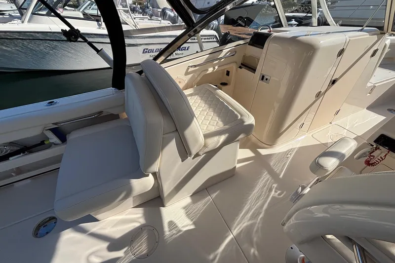 Slide: The Image of 2020 Grady-White Freedom 275 boat interior with luxurious seating and helm station. - 20