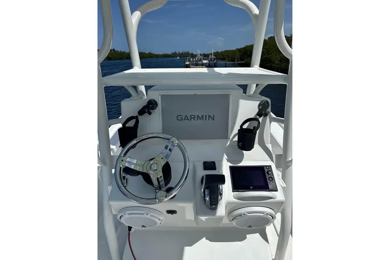 Slide: The Image of 2017 Yellowfin 24 Bay CE boat console with Garmin navigation system and steering wheel. - 12