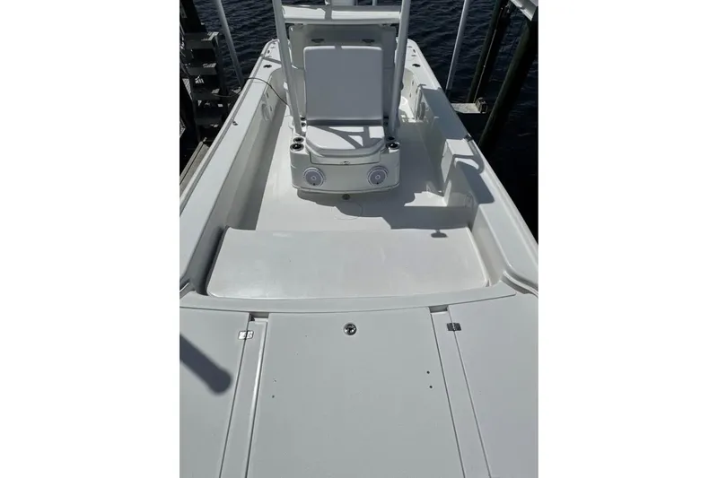 Slide: The Image of 2017 Yellowfin 24 Bay CE boat interior with seating and storage compartments. - 15