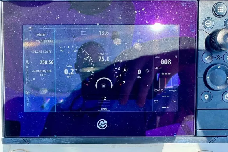Slide: The Image of Dashboard display of a 2017 Yellowfin 24 Bay CE boat showing engine and fuel data. - 16