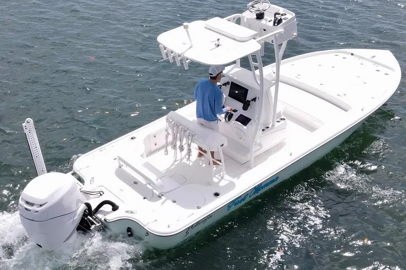 Slide: The Image of 2017 Yellowfin 24 Bay CE boat on water, featuring a sleek design and modern console. - 3