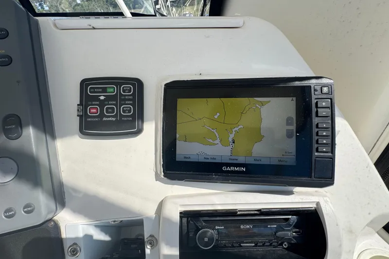 Slide: The Image of Control panel of a 2003 Silverton 42 Convertible with Garmin navigation system. - 22