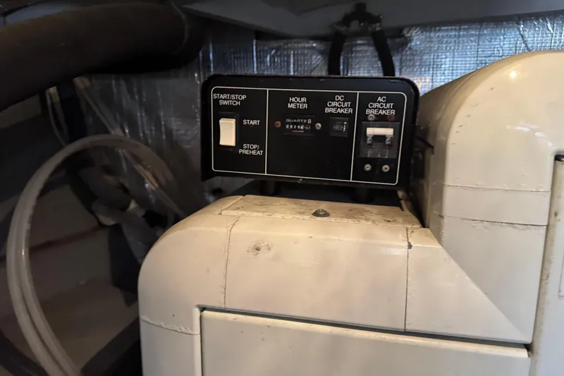 Slide: The Image of Control panel of a 2003 Silverton 42 Convertible boat, featuring switches and circuit breakers. - 30