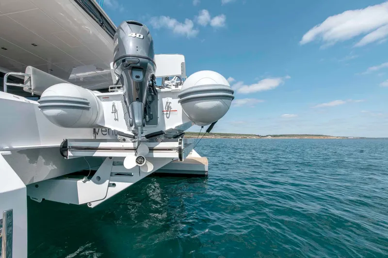 Slide: The Image of Luxury Privilege Signature 580 yacht with outboard motor, 2025 model, on clear blue water. - 20
