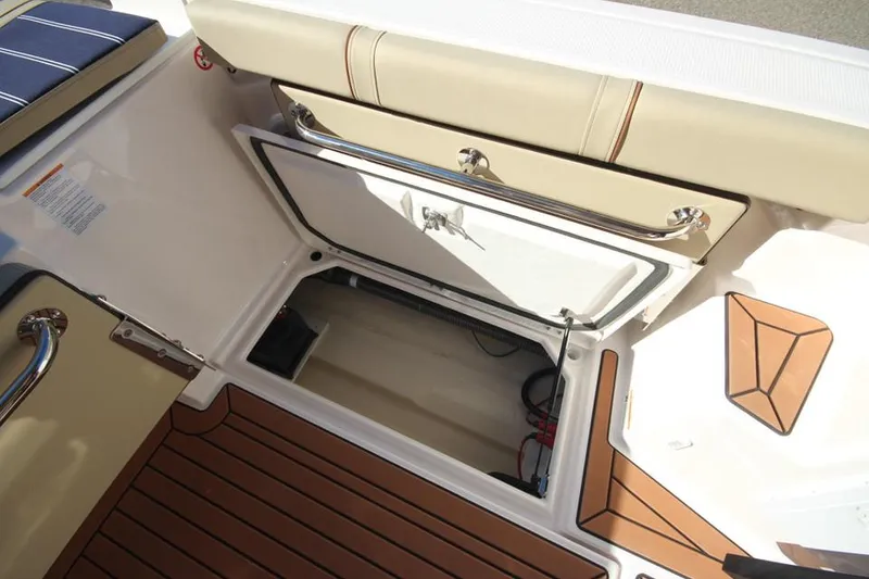 Slide: The Image of 2026 Ranger Tugs R-27 interior with electrical outlet, gauge, and faucet. - 14