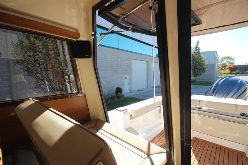 Slide: The Image of Control panel of 2026 Ranger Tugs R-27 boat with switches and gauges. - 19