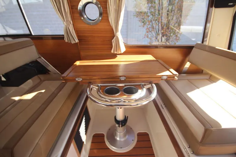 Slide: The Image of 2026 Ranger Tugs R-27 boat with Garmin radar system displayed indoors. - 29