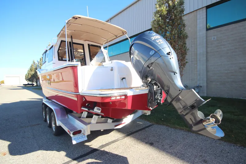 Slide: The Image of 2026 Ranger Tugs R-27 boat with built-in grill and sink on deck. - 5