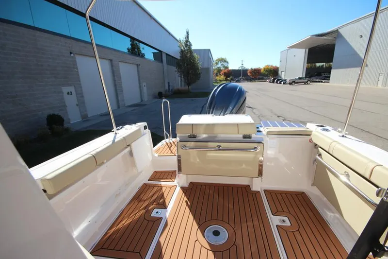 Slide: The Image of 2026 Ranger Tugs R-27 engine compartment with visible components and wiring. - 9