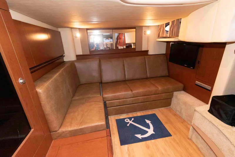 Slide: The Image of Interior of 2007 Sea Ray 40 Sundancer with leather seating and nautical decor. - 15