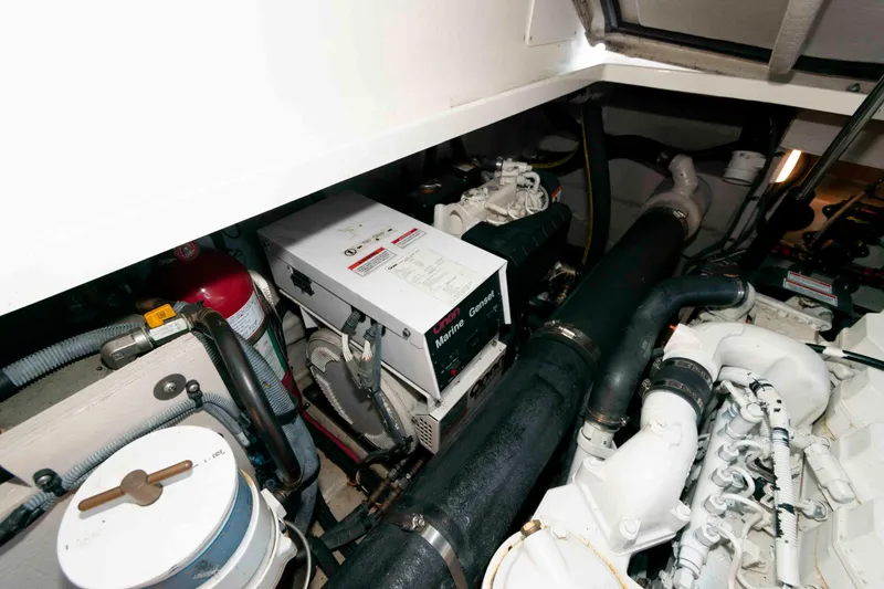 Slide: The Image of Engine room of 2007 Sea Ray 40 Sundancer with marine generator and components. - 19