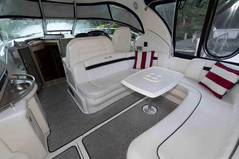 Slide: The Image of Luxurious interior of 2007 Sea Ray 40 Sundancer yacht with plush seating and table. - 2