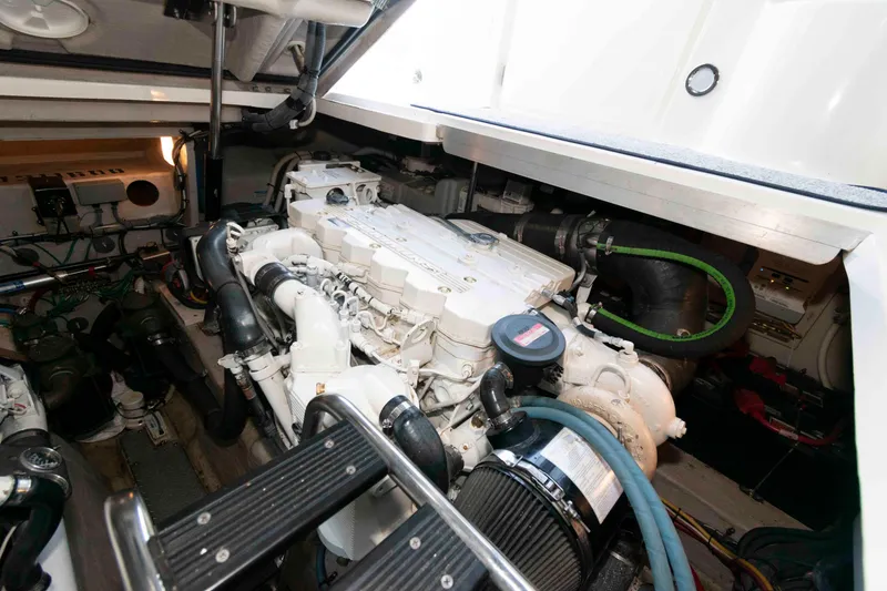 Slide: The Image of Engine room of a 2007 Sea Ray 40 Sundancer, showcasing detailed mechanical components. - 20