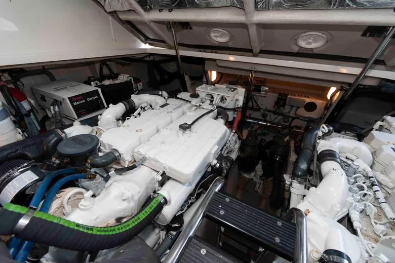 Slide: The Image of Engine room of a 2007 Sea Ray 40 Sundancer yacht, showcasing mechanical components. - 21