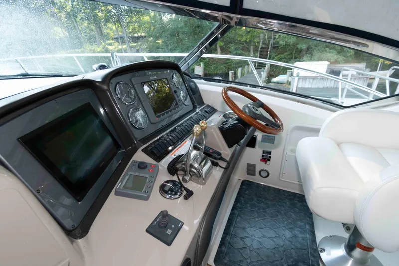 Slide: The Image of 2007 Sea Ray 40 Sundancer helm with modern controls and luxurious seating. - 4