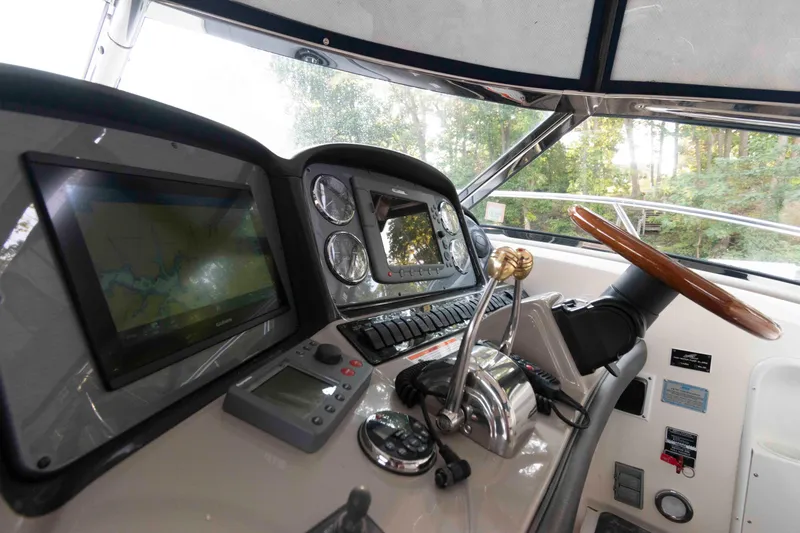 Slide: The Image of 2007 Sea Ray 40 Sundancer helm with navigation screens and controls. - 6