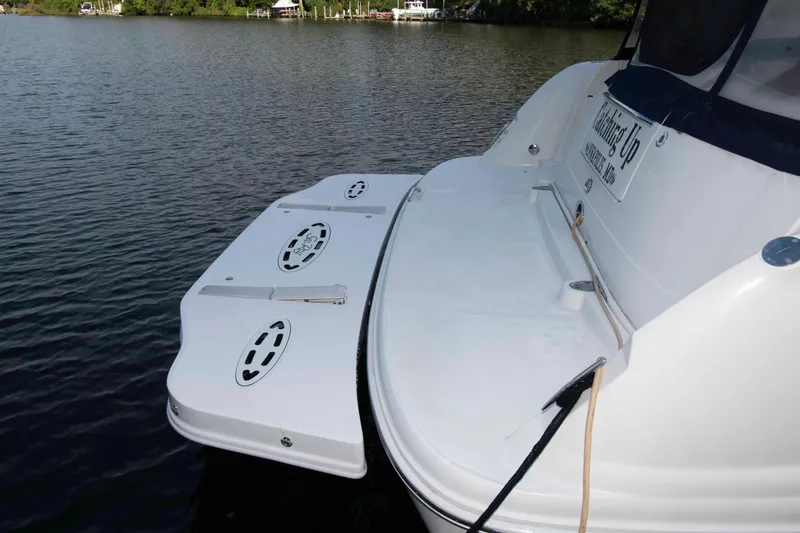 Slide: The Image of 2007 Sea Ray 40 Sundancer boat with swim platform on calm water. - 8