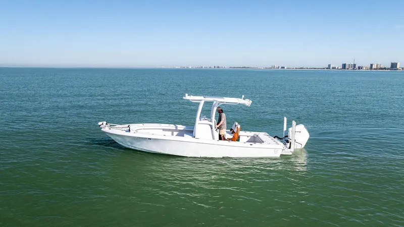 The Image of 2022 Barker Boatworks 26 Open on calm waters, clear sky in the background. - 0