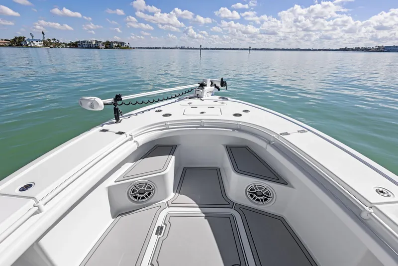 Slide: The Image of 2022 Barker Boatworks 26 Open on calm water, showcasing spacious deck and modern design. - 10