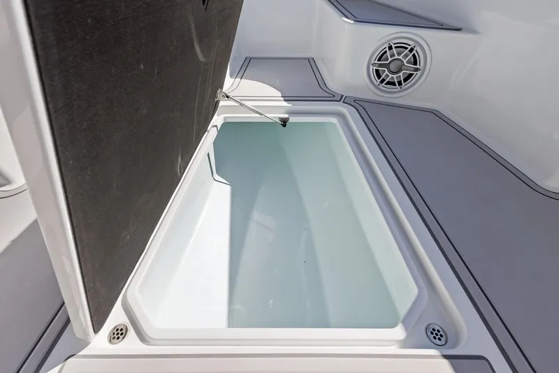 Slide: The Image of 2022 Barker Boatworks 26 Open storage compartment with speaker detail. - 11