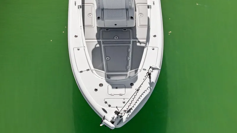 Slide: The Image of 2022 Barker Boatworks 26 Open on green water, aerial view. - 2