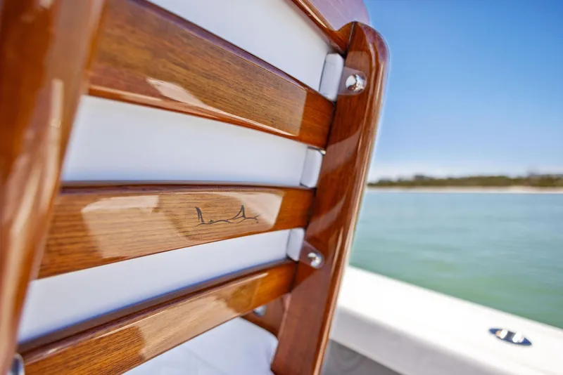 Slide: The Image of Close-up of 2022 Barker Boatworks 26 Open wooden seat detail. - 20