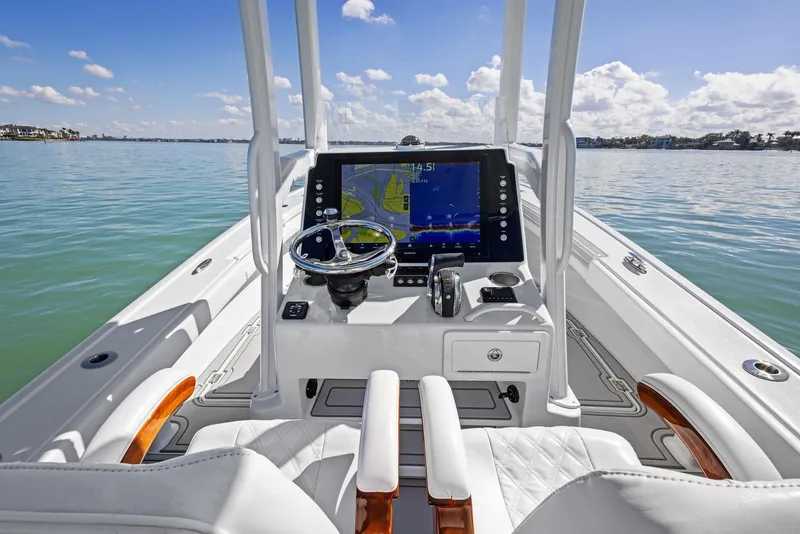 Slide: The Image of 2022 Barker Boatworks 26 Open helm with navigation display on calm water. - 21