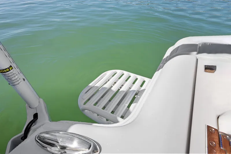 Slide: The Image of 2022 Barker Boatworks 26 Open swim platform on clear water. - 26