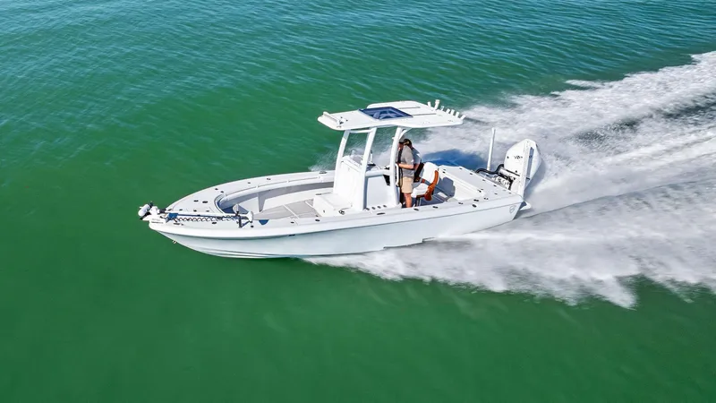 Slide: The Image of 2022 Barker Boatworks 26 Open cruising on clear green water. - 28