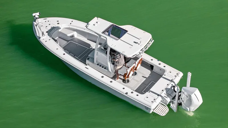 Slide: The Image of 2022 Barker Boatworks 26 Open in green water, aerial view. - 3