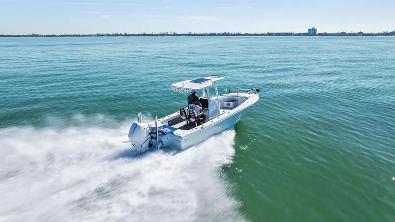 Slide: The Image of 2022 Barker Boatworks 26 Open cruising on open water, showcasing sleek design and performance. - 30